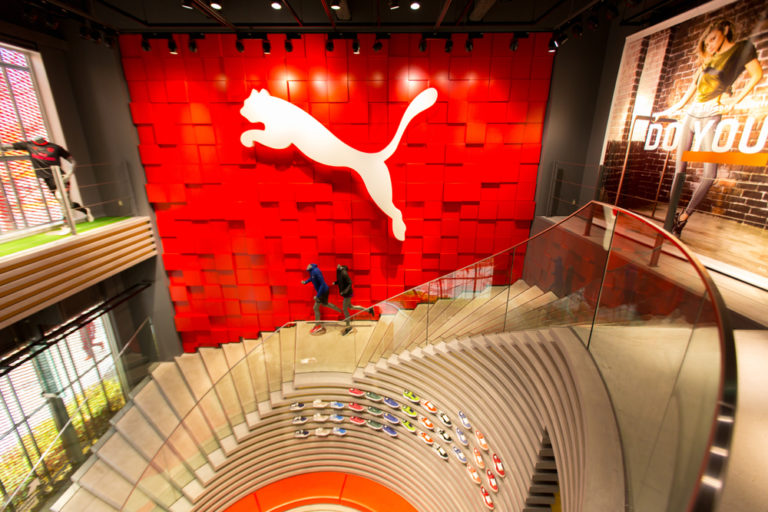 Puma shares rise on record sales results
